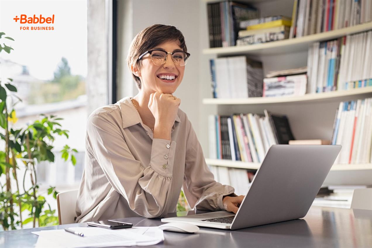 Woman at laptop smiling