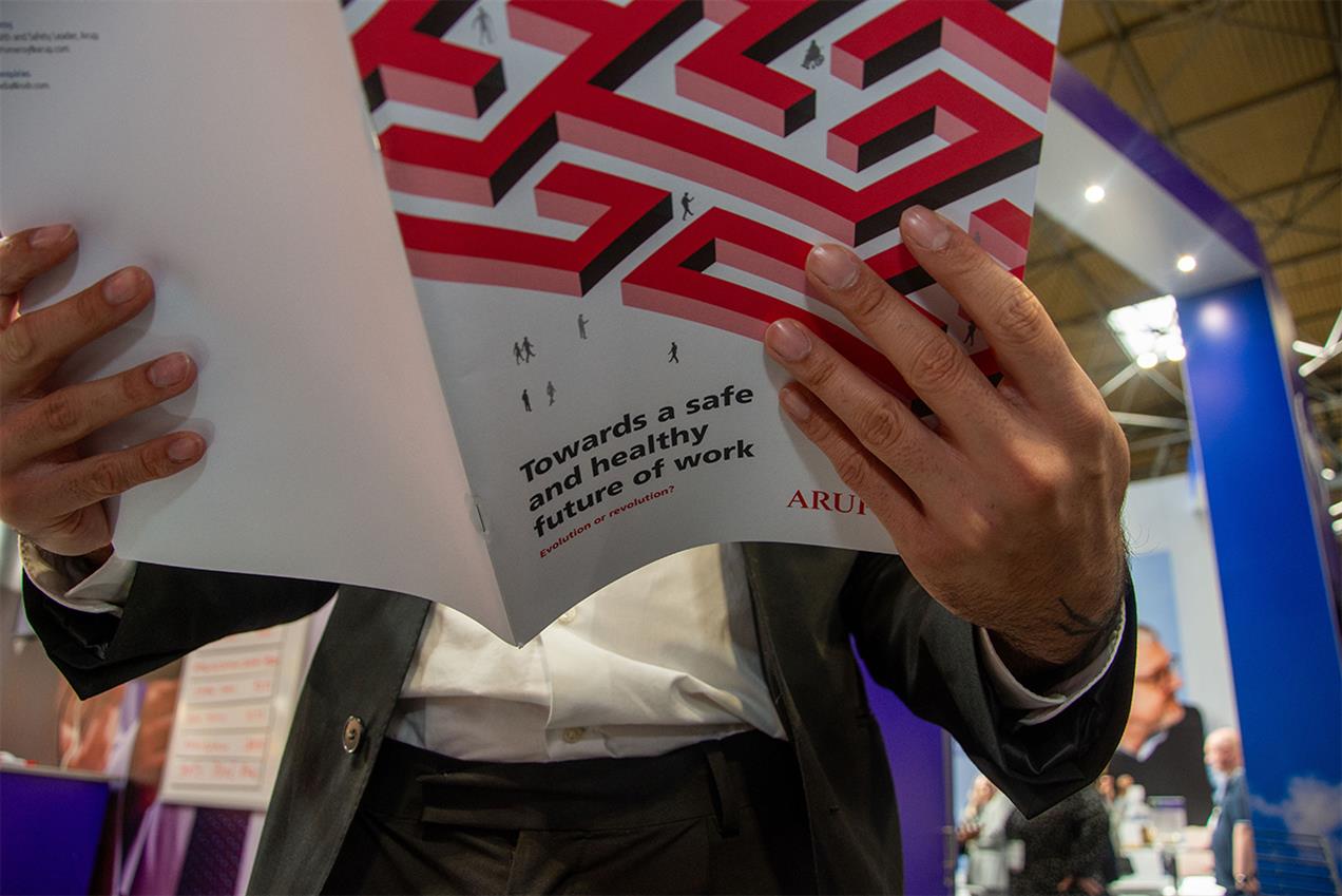 Photograph showing man reading the 'towards a safe and healthy future of work' report