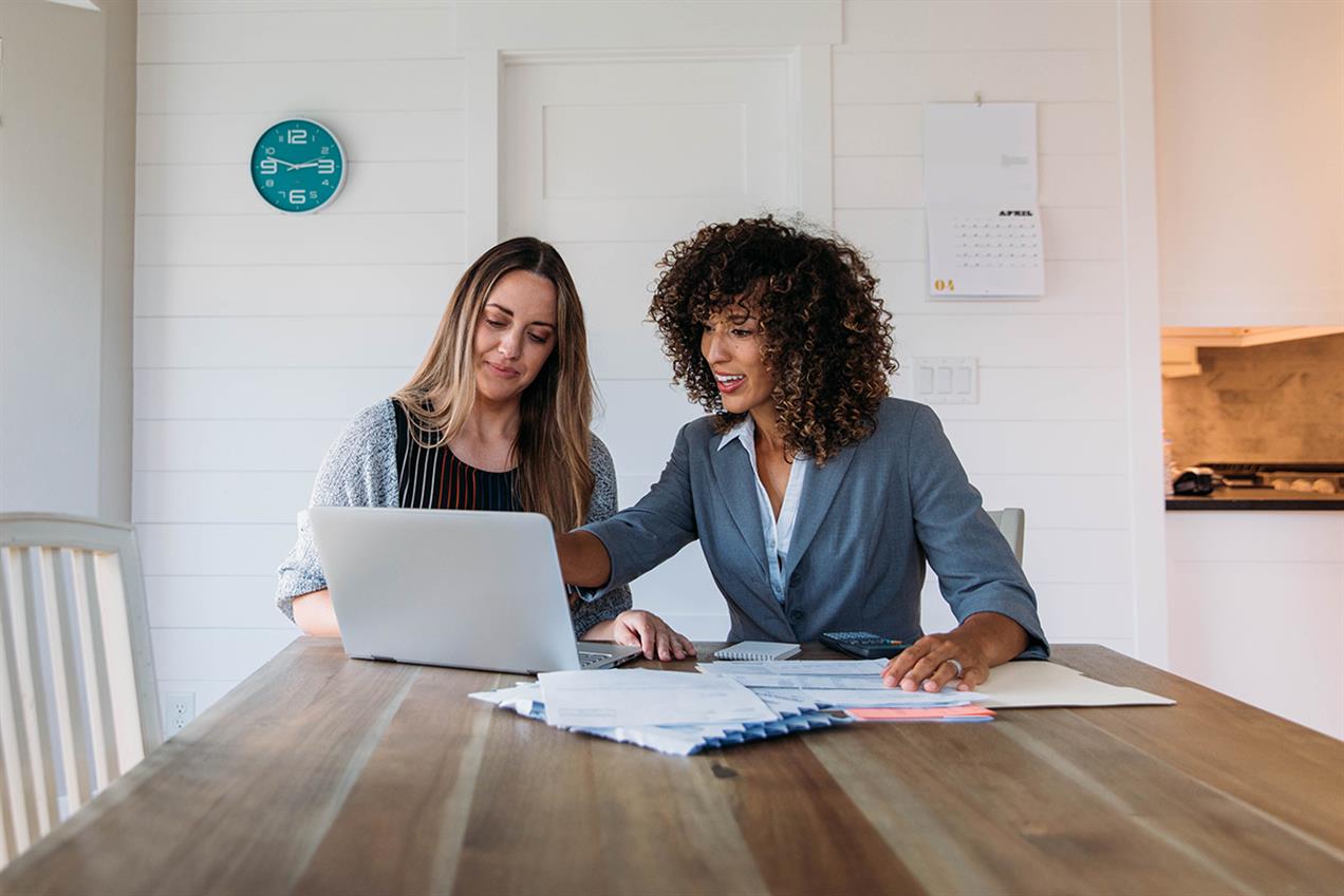 women at table talking about financial advice