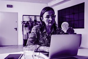 Woman with fan on laptop