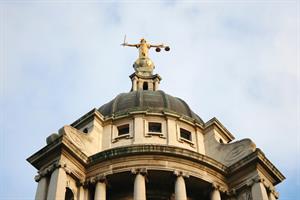 Court building with Lady Justice statue