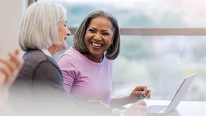 Two women having a conversation at work