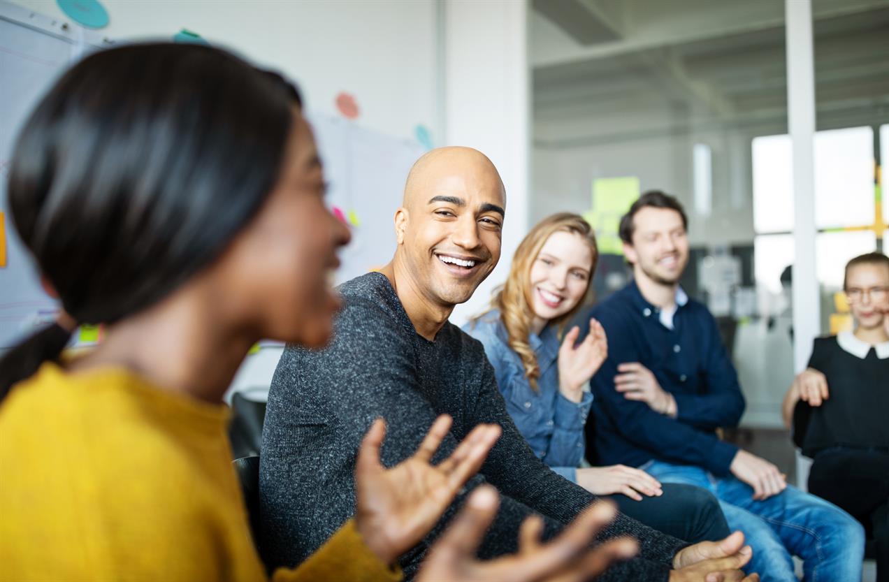 Diverse group of people discussing in office