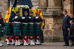 The Queen's coffin being held by people in Balmoral 