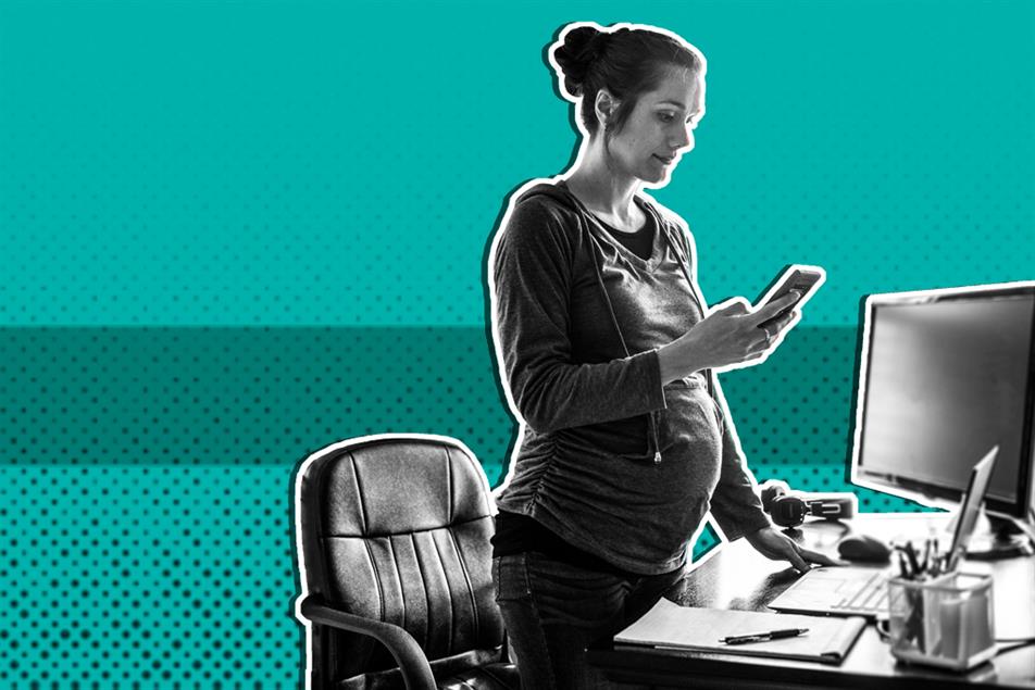 Pregrant women using smartphone in home office 