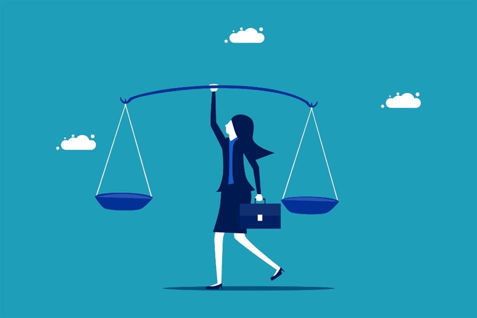 Woman holding scales of justice