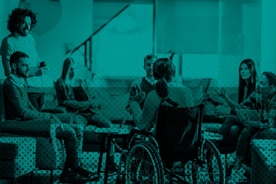 Group of people sat together in an office