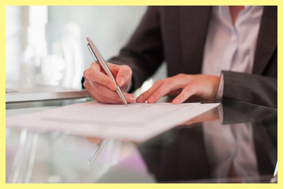 Man signing document