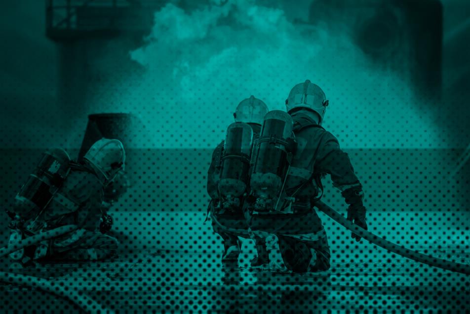 Group of firefighters in front of a fire