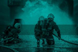 Group of firefighters in front of a fire