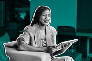 woman smiling at tablet