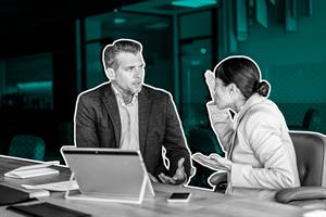 co-workers arguing during meeting 