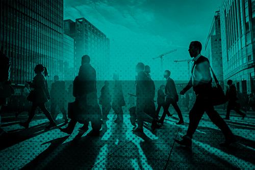 Many business people walking in a city