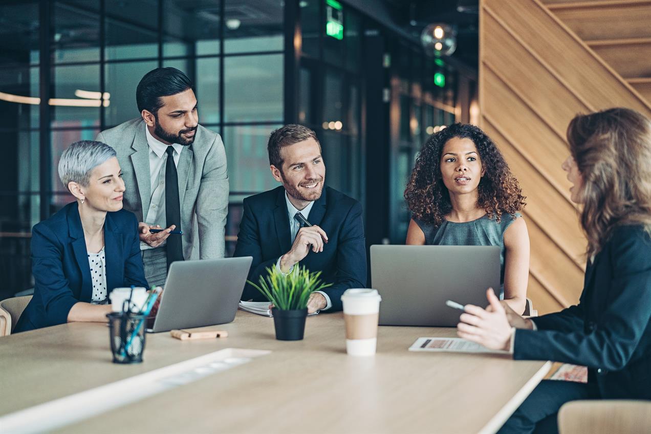 Colleagues discussing in office