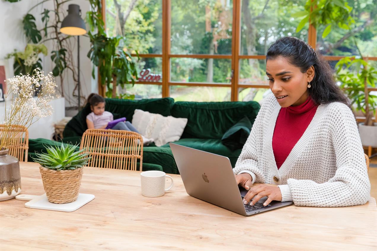 Woman working at home on laptop