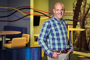Weetabix’s Stuart Branch standing next to tables and chairs