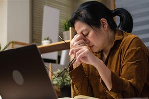 Woman sick at laptop