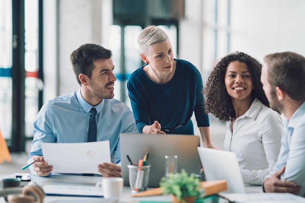 Group of colleagues discussing work