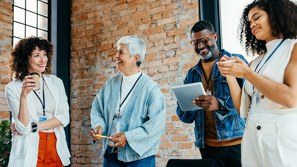 Group of colleagues smiling and laughing together 