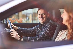 Image of man and woman in a car