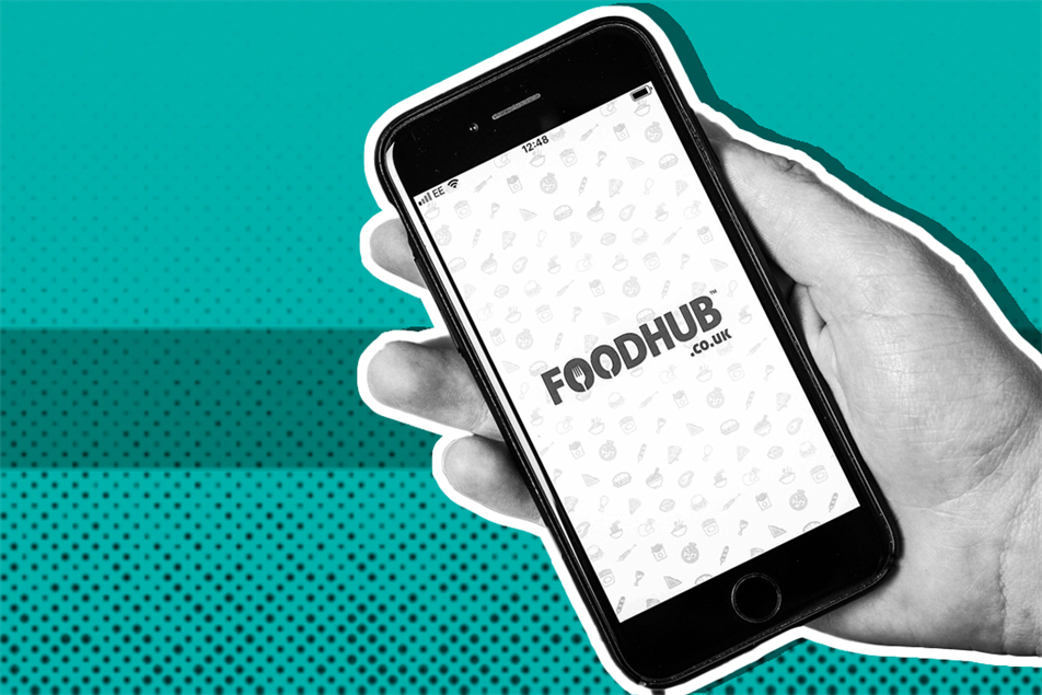 Hand holding a phone with the Foodhub app on it