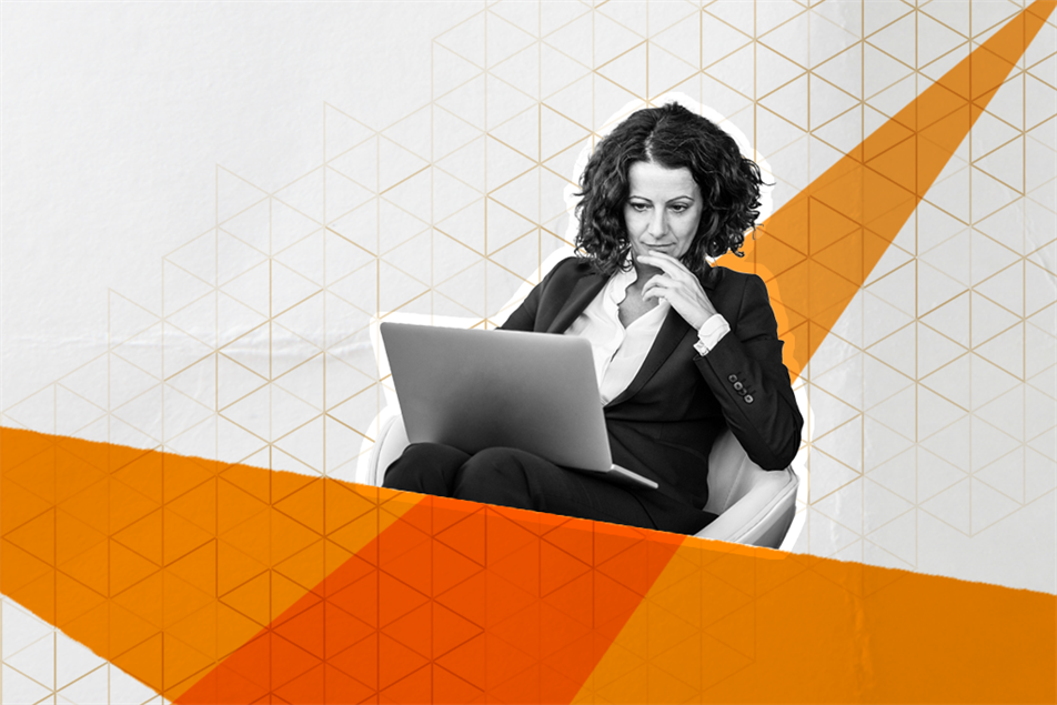 Woman sat looking at a laptop