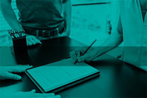 Close up of someone signing a contract