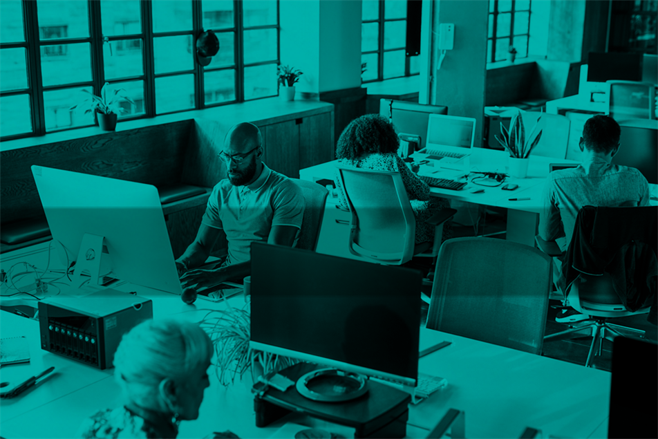 People sat at desks in an office