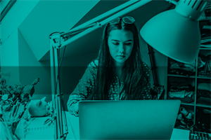 Young person sat at a home desk