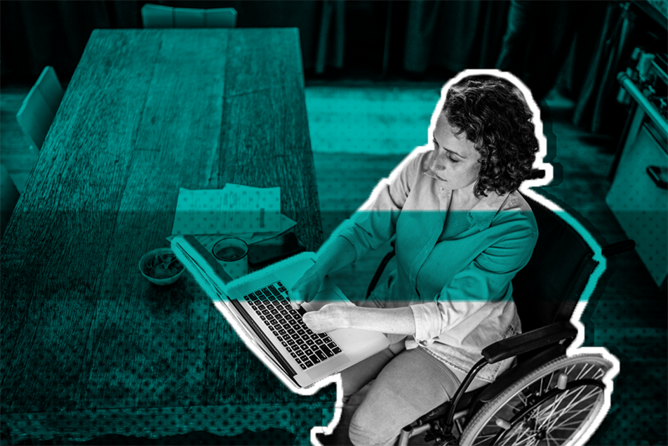 Person in a wheelchair typing on a laptop