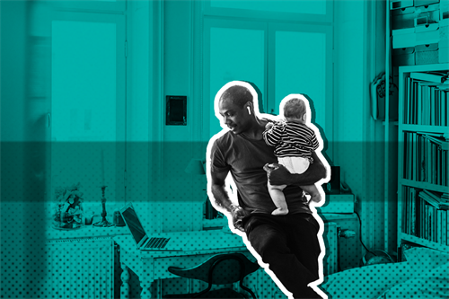 Man holding baby in front of a laptop