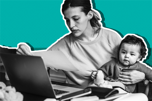 Woman with baby on her lap in front of laptop