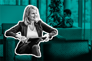 Person sitting on a chair in an office holding a tablet