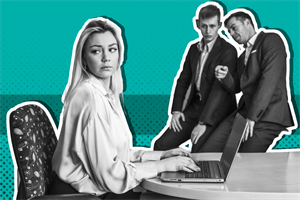 Two people looking and pointing at someone sat in front of a laptop