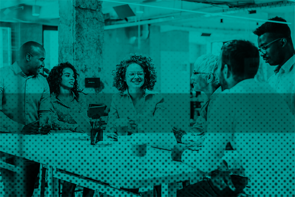 Group of people sat around a table