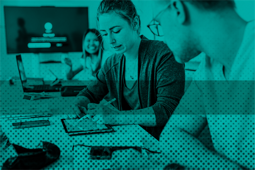 Person writing on a tablet