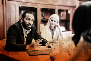 Group of people sat talking around a table