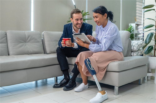 People sat on a sofa in an office