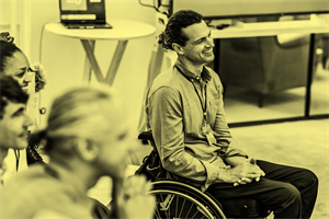 Person in a wheelchair smiling