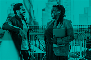 Two people talking outside