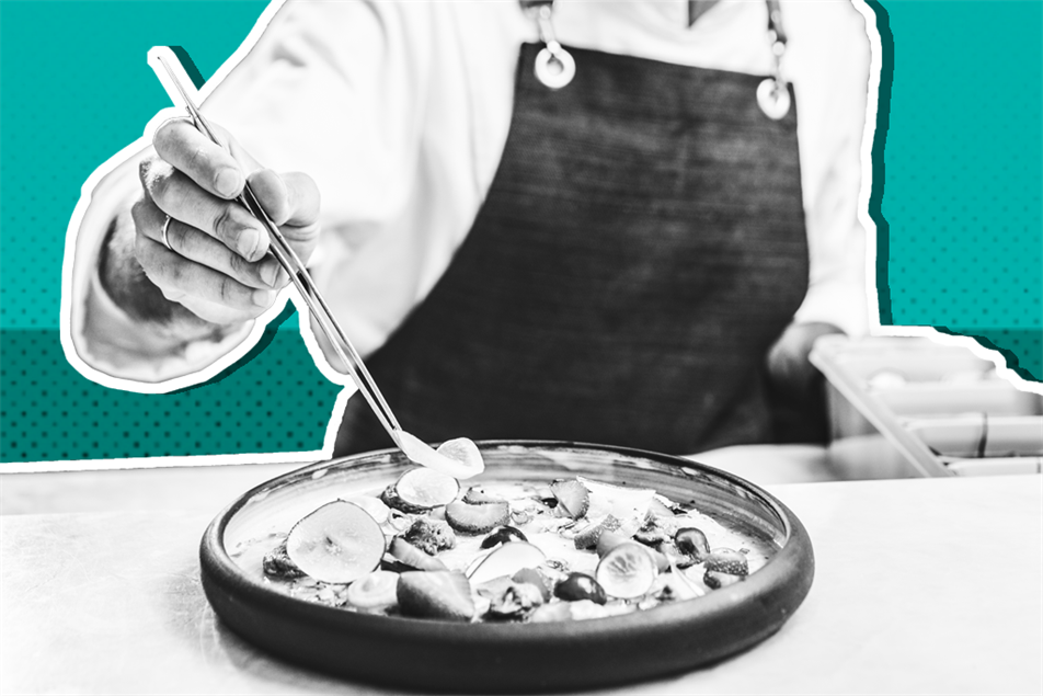 Close up of chef picking up food with tweezers