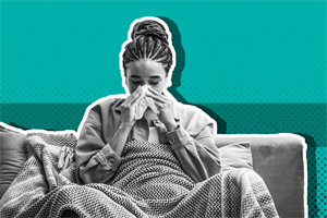 Ill woman sneezing on couch