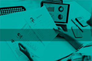 Close up of someone holding CVs