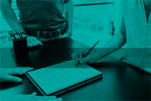 Close up of someone signing a contract