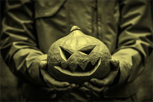 person holding a halloween pumpkin