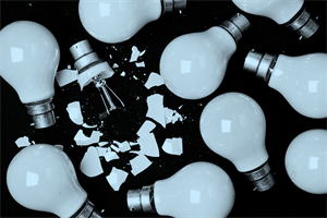 One broken lightbulb among whole lightbulbs
