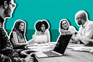 Group of people sat around a table talking