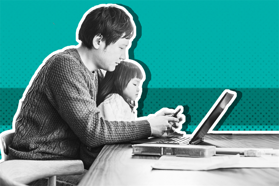 Father and child in front of laptop