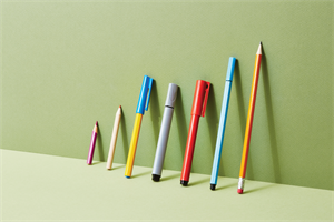 Pens and pencils leaning against a wall