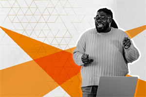 Person stood in front of a laptop